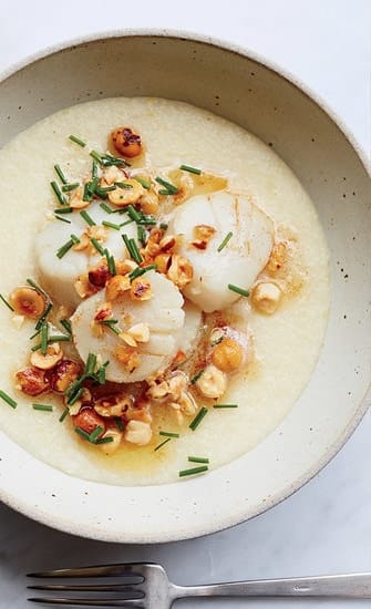 Seared scallops on a smooth chickpea purée with chopped hazelnuts and chives